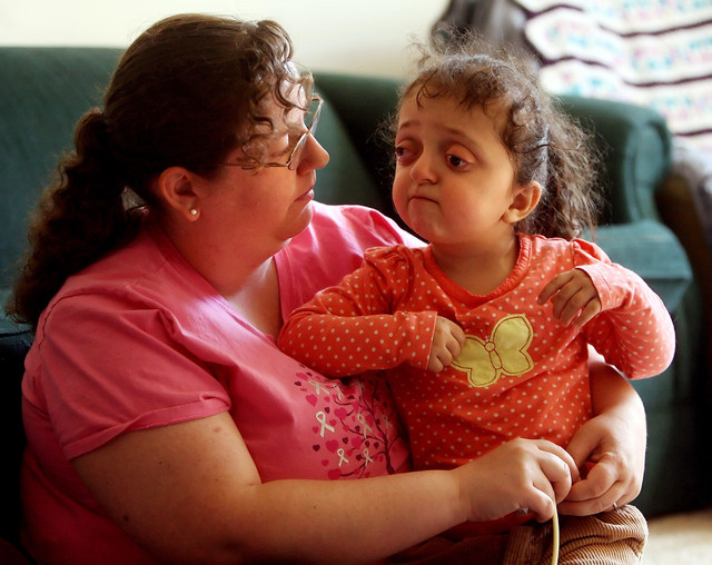 Elyza Carillo, 3, talks with her mom, Patrice at their Salt Lake City apartment home on Thursday, March 22, 2012. Elyza has hydrocephalus and has had a feeding tube implanted in her stomach since birth.
