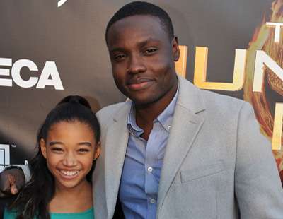 Amandla Stenger (L) and Dayo Okeniyi (R) play Rue and Thresh in "The Hunger Games"