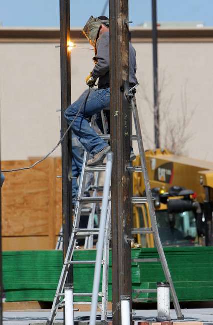 A welder works on TownePlace Suites in Vernal on Tuesday, March 27, 2012. The Marriott-owned property, which is slated to open later this year, is part of a commercial and retail building boom taking place in Vernal after a two-year lull. (Photo: Geoff Liesik, KSL News)
