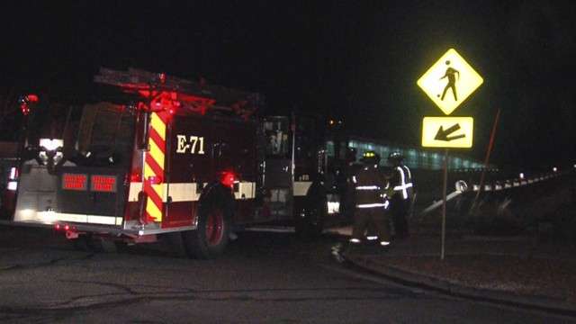 Firefighters respond the scene of the auto pedestrian accident that killed 16-year-old Andrew Tolman on March 21, 2012.