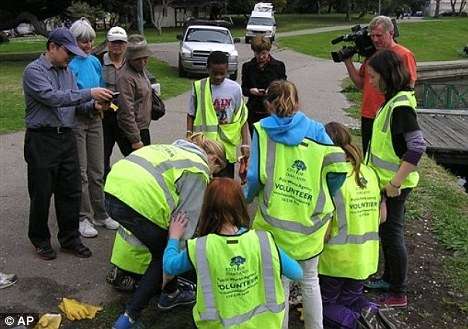 Students find buried treasure during lake clean-up