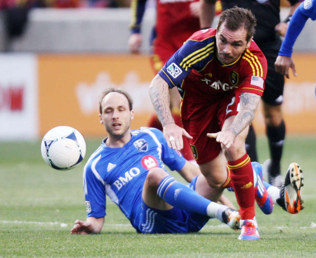 Jonny Steele of Real Salt Lake fights for control of the ball against Justin Mapp of the Montreal Impact during their MLS match up at Rio Tinto Stadium in Sandy Wednesday, April 4, 2012. (Brian Nicholson, Deseret News)