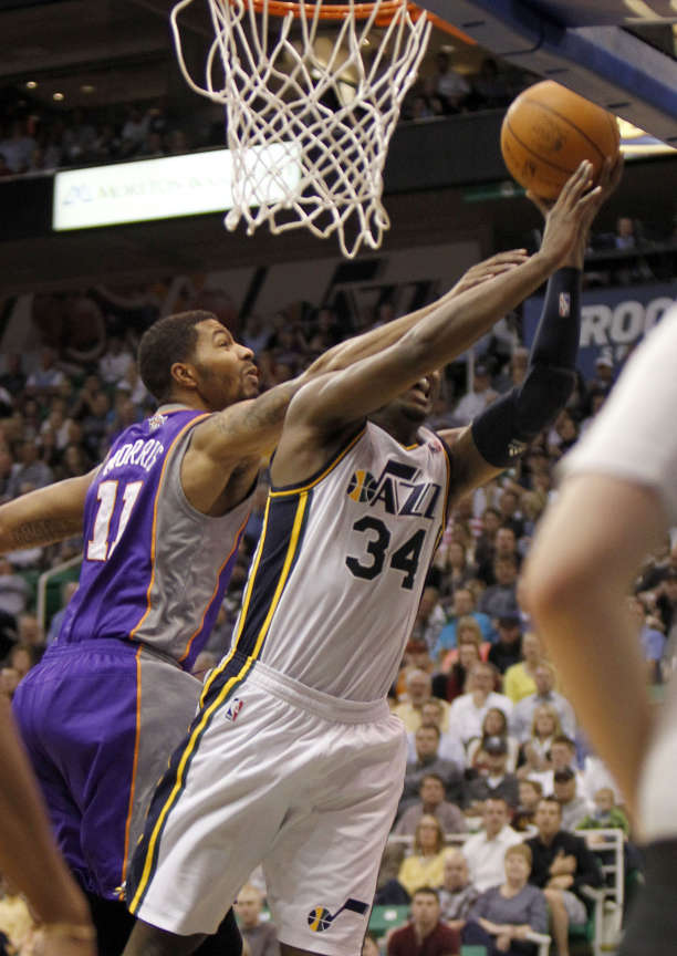Utah's CJ Miles drives past Sun's Markieff Morris and is fouled as the Utah Jazz are defeated by the Phoenix Suns 107-105 as they play NBA basketball Wednesday, April 4, 2012, in Salt Lake City, Utah. (Tom Smart, Deseret News)