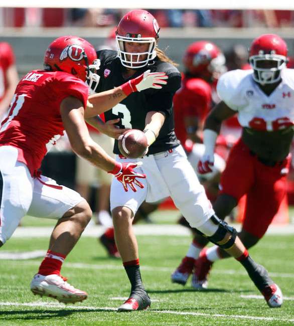 Red's #3 Jordan Wynn hands off to #21 Harvey Langi as the play in the Utah football Red & White Spring Game Saturday, April 21, 2012 at Rice Eccles Stadium. (Scott G Winterton, Deseret News)