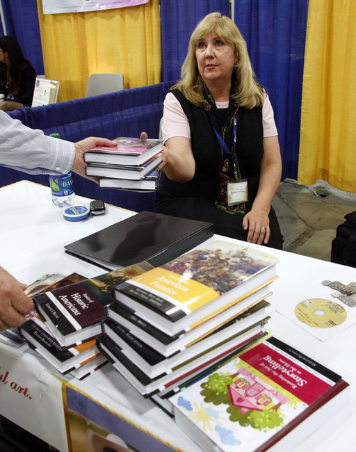 Marlene Peterson packs up her books at her booth at first lady Jeanette Herbert's Parenting Conference and Expo at the Salt Palace in Salt Lake City on Friday, May 4, 2012. (Photo: Kristin Murphy, Deseret News)