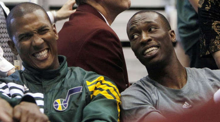 Utah Jazz guard Raja Bell (19),left, and Utah 
Jazz forward Josh Howard (8) share a laugh. 
(Scott G. Winteron/Deseret News)