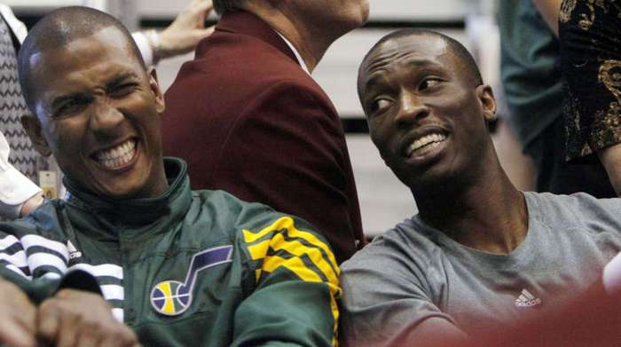 Utah Jazz guard Raja Bell (19),left, and Utah
Jazz forward Josh Howard (8) share a laugh.
(Scott G. Winteron/Deseret News)