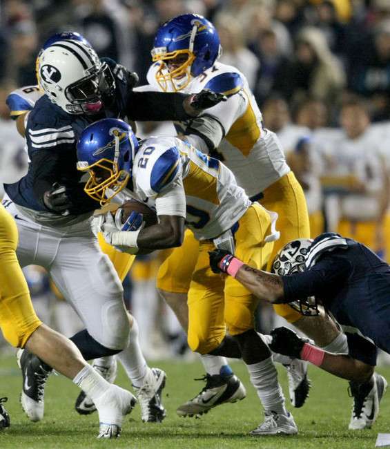 Brigham Young Cougars linebacker Ezekiel Ansah (47) tackles San Jose State Spartans defensive back Tyler Ervin (20) during the first quarter of a football game at the Lavell Edwards Stadium in Provo on Saturday, Oct. 8, 2011. (Kristin Murphy, Deseret News)