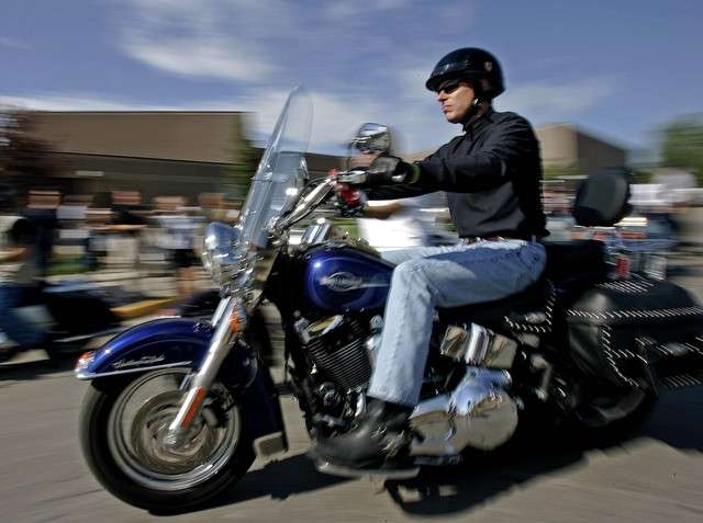 Utah Gov. Jon Huntsman rides a motorcycle at the Sturgis Motorcycle Rally Aug. 7, 2006, in Sturgis, S.D. Huntsman has been named one of the "21 Sexiest Men Over 50," according to the AARP. (Photo: Morry Gash, AP)