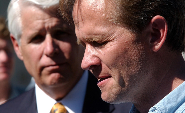 Ed Smart talks about the abduction of his 14-year-old daughter Elizabeth as Salt Lake City Police Chief C.F. "Rick" Dinse listens during a press conference near the Smart family home in Federal Heights Wednesday, June 5, 2002.