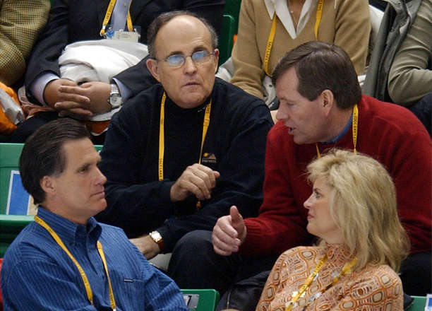 Former New York City Mayor Rudolph Gulliani, 
left, sits with Utah Gov. Mike Leavitt, right, 
SLOC president Mitt Romney, bottom left and his 
wife Ann, between races at the Short Track 
competition Saturday, Feb 23, 2002 at the Salt 
Lake Ice Center. (Scott G. Winterton/Deseret 
News)