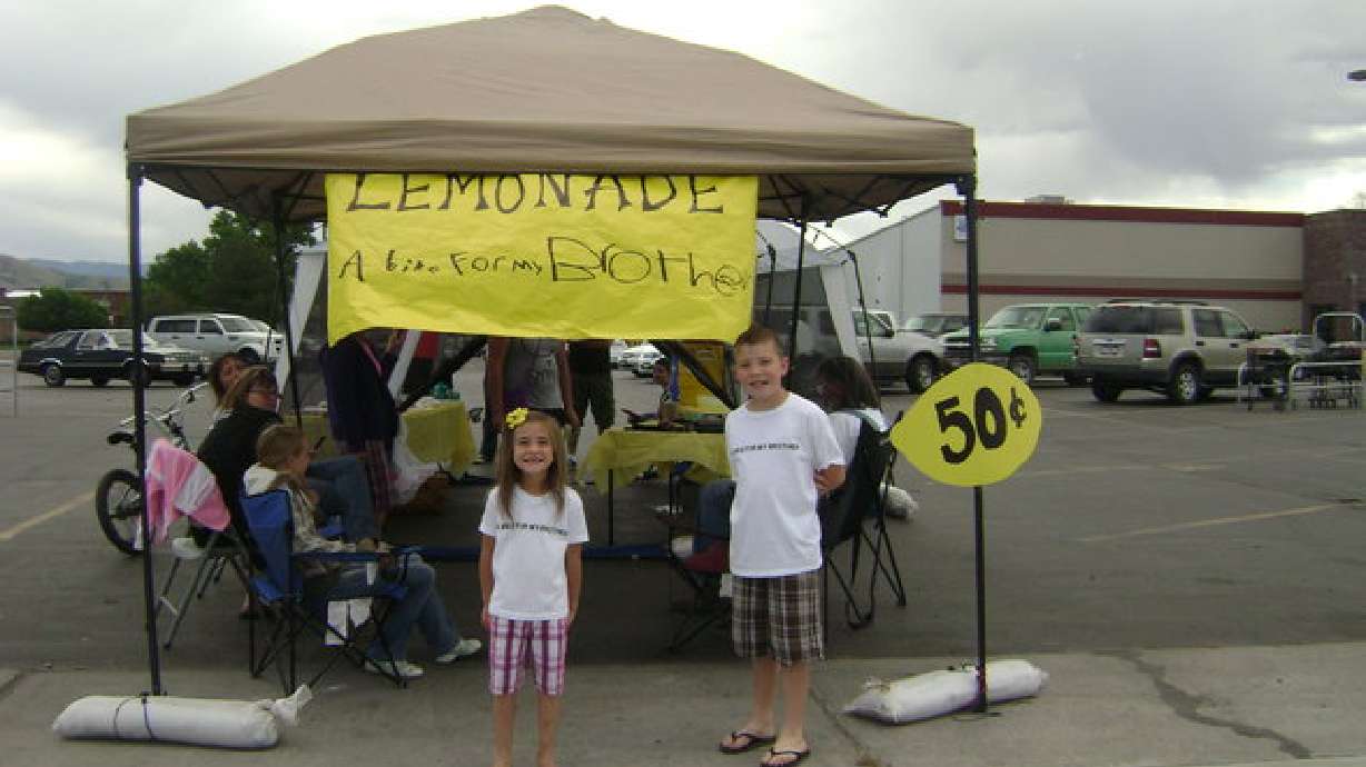With lemonade, siblings earn bike for disabled brother