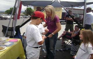 With lemonade, siblings earn bike for disabled brother