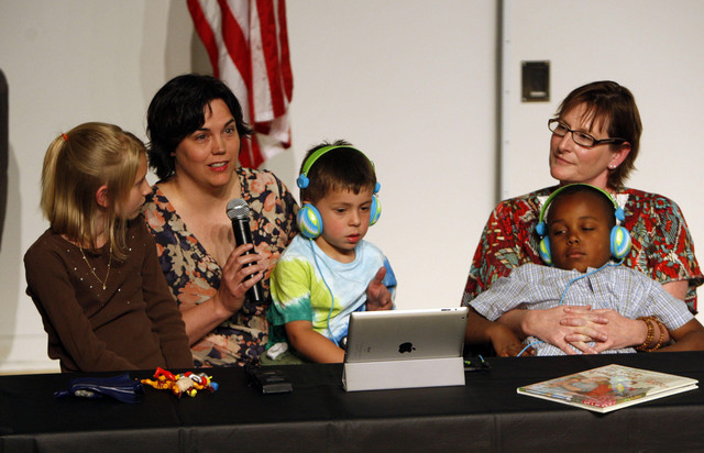 Michelle Hasting with her wife, Jamila Tharp, and their children children, Abigail, Alexander and Kaiden, (left to right) talks during a forum named, Community Stands up Northern Utah Addresses LGBT Bullying and Suicide.The panel raised concerns over removal of the book, "In Our Mothers' House," and it's the story of two homosexual women raising children in a "non- traditional household", in a Davis County Elementary School which placed the book "behind the counter," Monday, June 11, 2012, in Ogden, Utah.