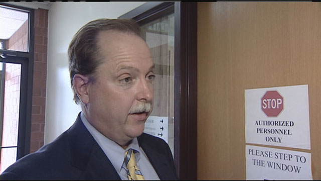 Public defender charged with extorting money, property from clients