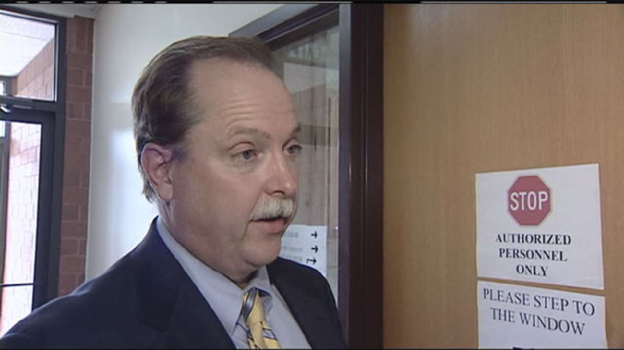 Public defender charged with extorting money, property from clients