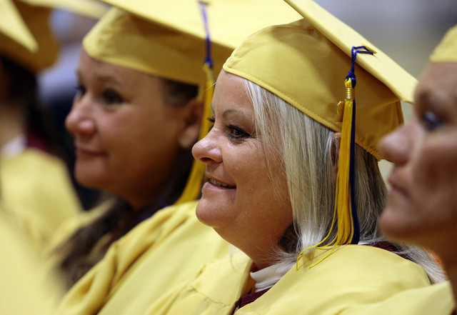 Inmates listen to commencement speaker, former BYU and San Francisco 49ers football player Jamal Willis, during the graduation of the Canyons School District's South Park Academy at the Utah State Prison in Draper Wednesday, June 13, 2012.