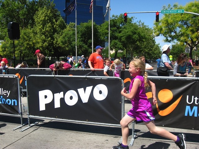 Kaitlynne Cowart finishes the Kids 1K race in 2012.