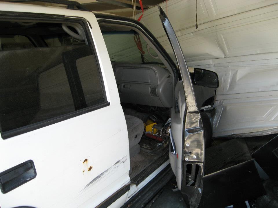 Damage to the man's garage door.