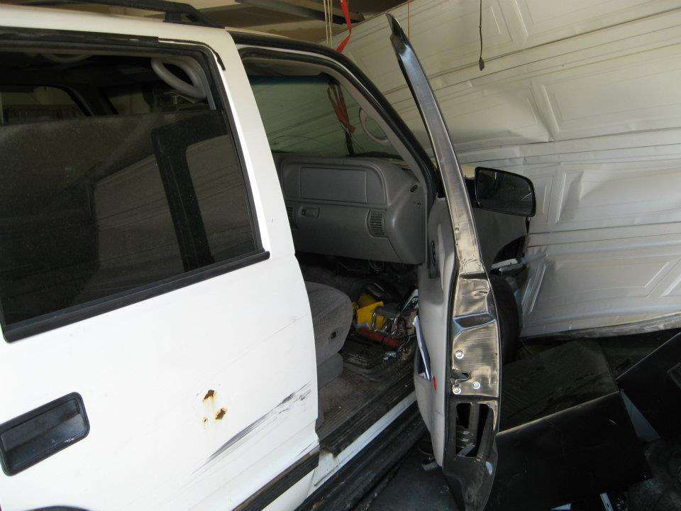 Damage to the man's garage door.