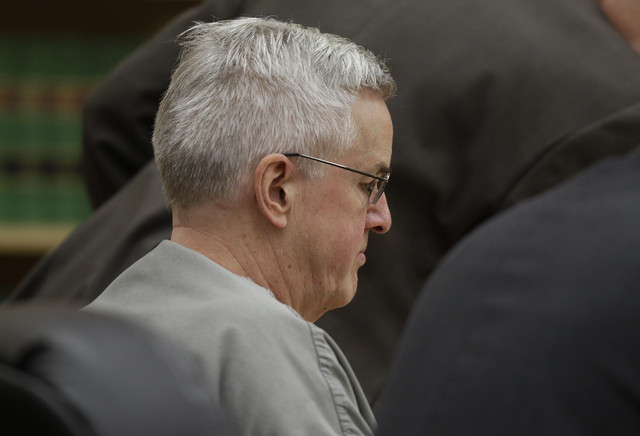 Steve Powell sits in a courtroom shortly after he was sentenced to 2 1/2 years in prison for voyeurism, June 15, 2012, in Tacoma, Wash. A civil lawsuit was filed in court Wednesday against Powell, the father-in-law of missing Utah mother Susan Cox Powell, on behalf of the two children he photographed.