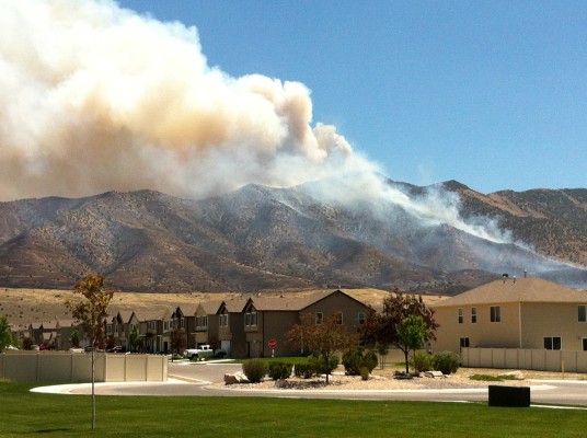 Evacuees return home as Eagle Mountain fire continues to rage