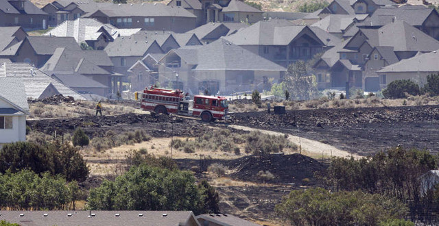 Firefighters work on the Rose Crest Fire in
Herriman.