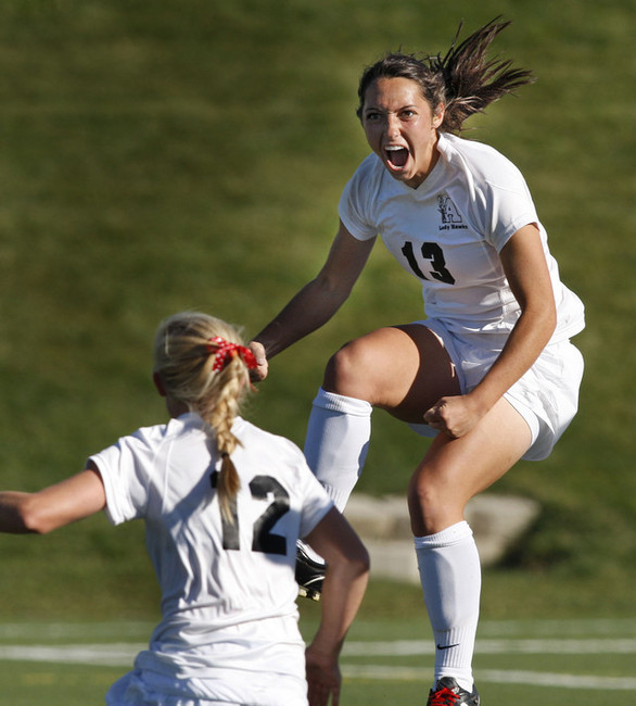 Lexe Selman, right, and team mate Bizzy Phillips hug after Selman scored the first of her two first half goals as Alta High School and Davis High School play in the 5A girl's state soccer semi-final game Tuesday, Oct. 18, 2011, in Draper, Utah.
(Tom Smart, Deseret News)