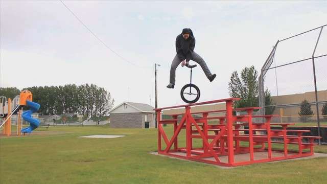 Keven Kartcher performs one of his extreme
unicycling tricks.