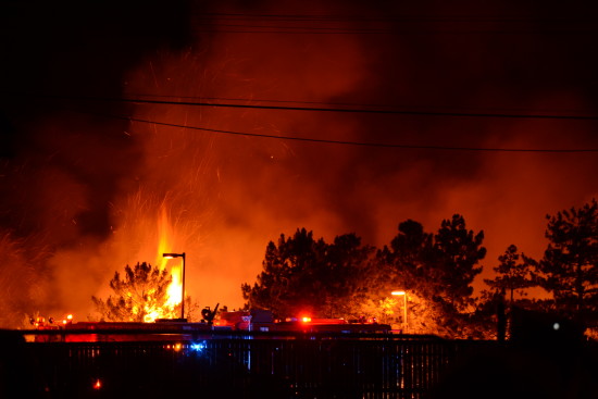 PHOTOS: Late-night fireworks set neighborhood field ablaze
