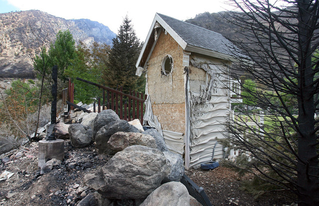 Flames nearly destroyed a play house at the home of James Patterson. Fire officials give a tour of the Quail Fire in Alpine Friday, July 6, 2012. (Photo: Scott G. Winterton, Deseret News)