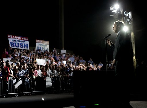 President Bush talks to a group of several thousand supporters after landing at Salt Lake International Airport on Wednesday, Aug. 30, 2006 in Salt Lake City, Utah. (AP Photo/Evan Vucci)