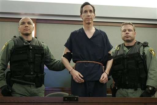 Warren Jeffs appears in a courtroom surrounded by guards in Las Vegas, Thursday, Aug. 31, 2006. Jeffs waived his right to extradition and will be returned to Utah for trial.(AP Photo/Laura Rauch)