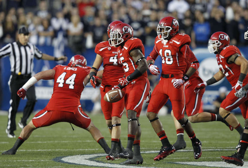 Utah Utes defensive back Michael Walker (15) celebrates with teammates after he recovered a fumble as the University of Utah and Brigham Young University play football Saturday, Sept. 17, 2011, in Provo, Utah. (Tom Smart, Deseret News)