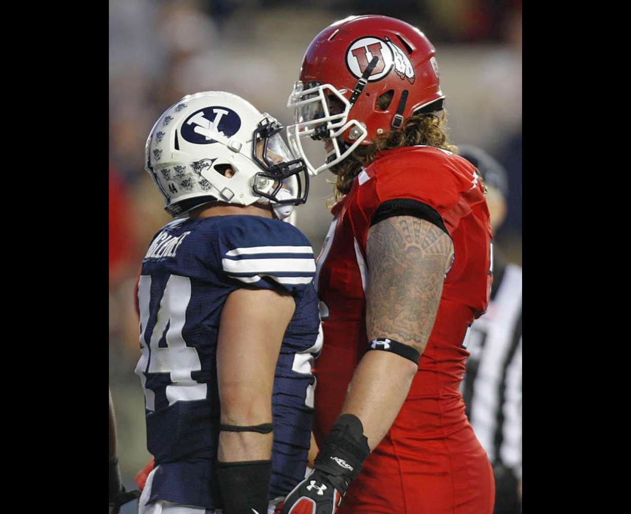 Brigham Young Cougars linebacker Brandon Ogletree (44) and Utah Utes offensive linesman John Cullen (77) get in each other's face as BYU and Utah play Saturday, Sept. 17, 2011 (Scott G Winterton, Deseret News)