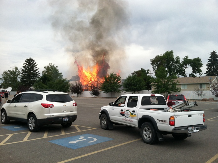 Fire destroys house, damages neighboring structures