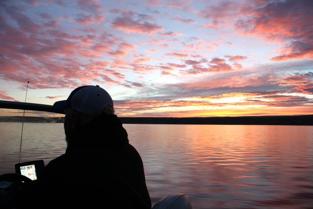 Heading out on the lake at sunrise with our
guide, Ashley Bonser. (Photo: Grant Olsen)