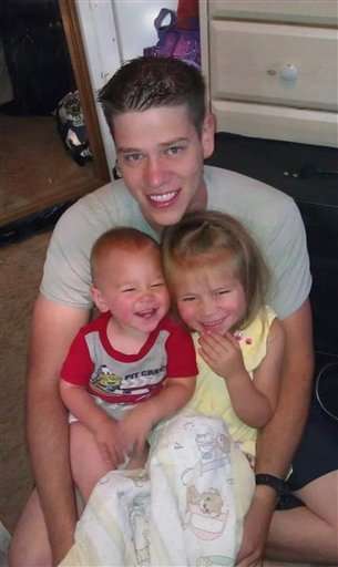 This undated photo provided by the family shows
Jonathan T. Blunk, 26, of Aurora, Colo. with
his two children. Blunk was one of the victims
in the Friday, July 20, 2012 Aurora, Colo.
movie theater shooting. (AP Photo)