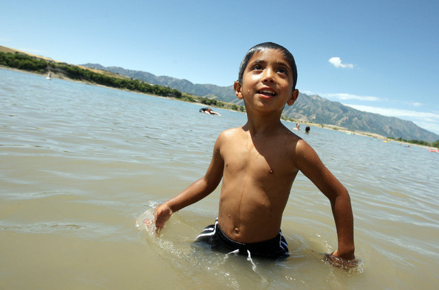 Frankie Alvizures plays on the water at Hyrum 
State Park in Hyrum Saturday, July 21, 2012. 
Hyrum State Park Ranger Chris Haramoto and ESL 
teacher Jodie Madsen have teamed up on an 
initiative to increase use of Hyrum State Park 
by Latinos after Madsen's master's thesis 
detected a reticence to visit state and 
national parks.