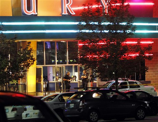 Police are pictured outside of a Century 16 
movie theatre where as many as 14 people were 
killed and many injured at a shooting during 
the showing of a movie at the in Aurora, Colo., 
Friday, July 20, 2012. (AP Photo/Ed Andrieski)