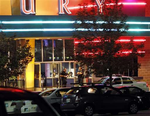 Police are pictured outside of a Century 16
movie theatre where as many as 14 people were
killed and many injured at a shooting during
the showing of a movie at the in Aurora, Colo.,
Friday, July 20, 2012. (AP Photo/Ed Andrieski)