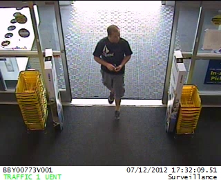 Surveillance image of suspect believed to have used his cell phone to take pictures underneath a woman's skirt at the Orem Best Buy Show. (Photo: Orem Department of Public Safety)