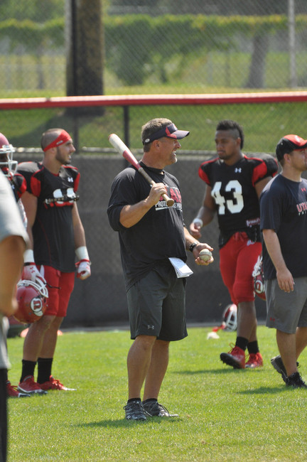 The Utes had a little fun after practice Tuesday. Since they are practicing on the baseball field during camp, they decided to channel their inner baseball player with a pop fly competition. Hitting was head coach Kyle Whittingham. Photo: Brooke Frederickson, Utah Associate Director of Communications