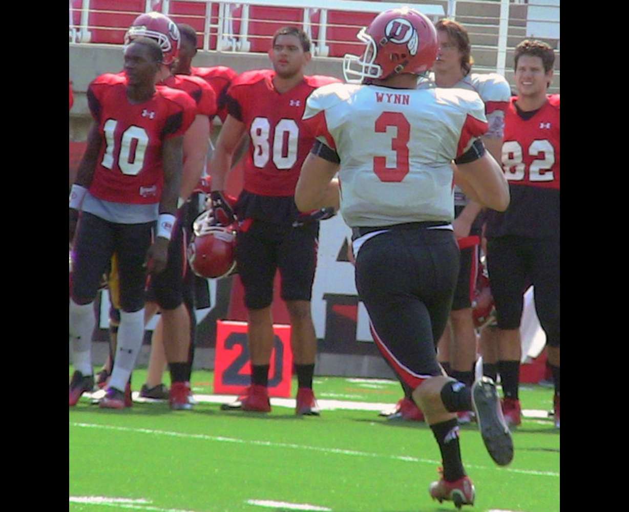 Utah quarterback Jordan Wynn (3) rolls out to the right looking for a receiver during Wednesday's practice at Rice-Eccles Stadium in Salt Lake City. Photo: Robert Jackson, KSL
