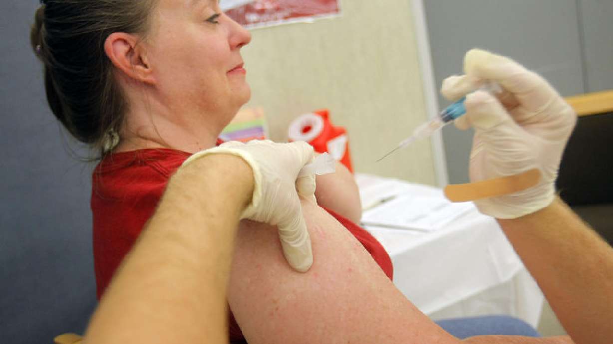 Kristina Nokes receives a flu shot from Scott Kendall at Rite Aid Pharmacy in Murray on Aug. 7, 2012. Doctors believe this flu season might be a severe one in the U.S. after Australia's season just ended — and with it took 300 lives and caused 1,700 hospitalizations.