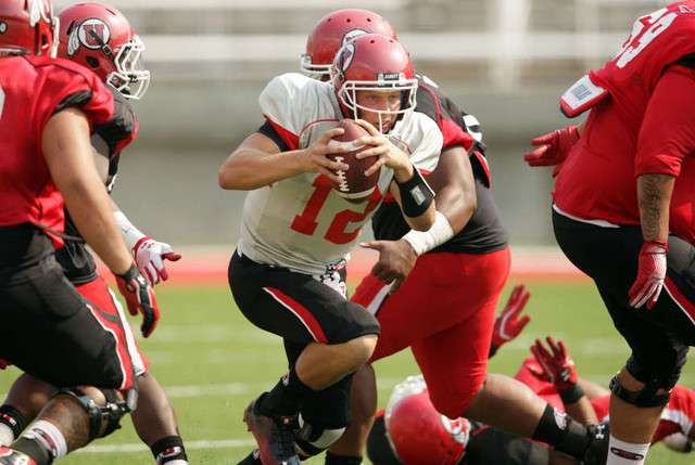 Utah Utes quarterback Adam Schulz (12) scrambles during practice at Rice-Eccles Stadium in Salt Lake City Tuesday, Aug. 14, 2012. (Jeffrey D. Allred, Deseret News)