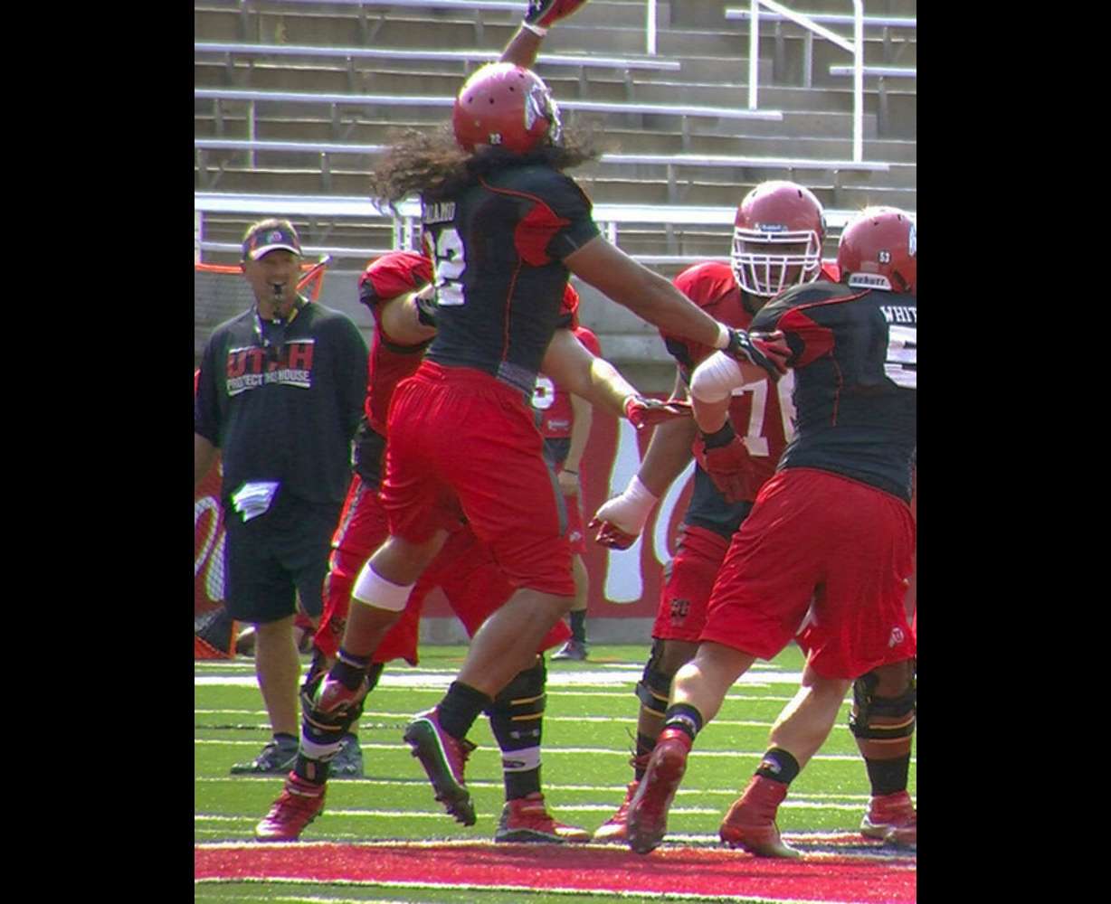 Utah defensive end Thretton Palamo jumps to bat down a pass during Wednesday's practice at Rice-Eccles Stadium. Photo: Robert Jackson, KSL