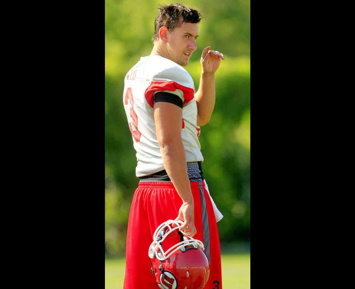 Utah's Quarterback #3 Jordan Wynn takes off his helmet during football practice Monday, Aug. 20, 2012. (Scott G Winterton, Deseret News)