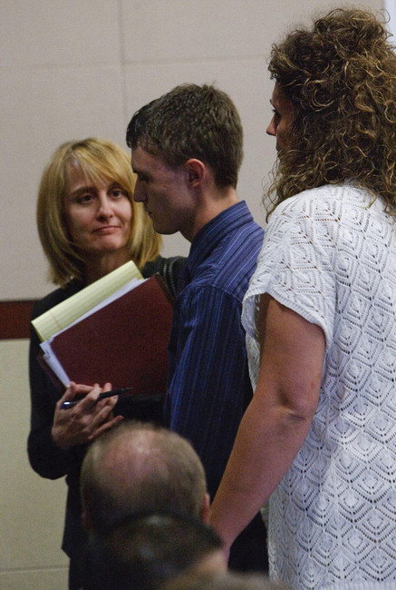 Dallin Todd Morgan, 18, pleaded no contest Thursday, Aug. 30, 2012, to criminal mischief in a plot to bomb an assembly at Roy High School earlier this year. He was ordered to serve 105 days in jail and up to 18 months probation. He leaves the courtroom flanked by his attorney Brenda Beaton, left, and his mother, right. (Photo: Leah Hogsten)