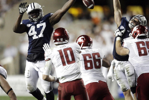 Brigham Young Cougars linebacker Ezekiel Ansah (47) blocks a pass by Washington State Cougars quarterback Jeff Tuel (10). (Jeffrey D. Allred, Deseret News)